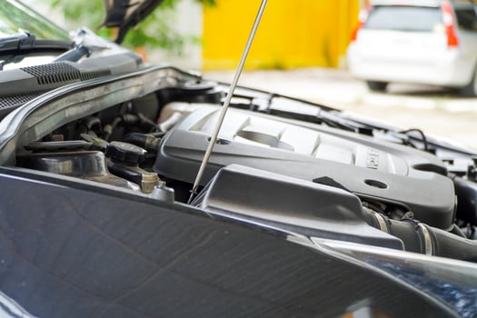 Mechanic removing the air filter cover of the car,maintenance concept photo