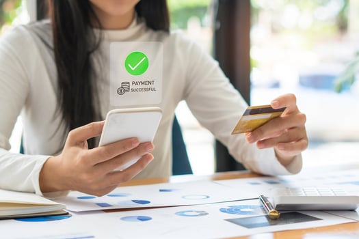 Woman using mobile smart phone, online payment, banking and online shopping at home. Business and technology. photo