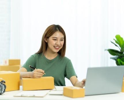 Starting small businesses SME owners female entrepreneurs check online orders to prepare to pack the boxes, sell to customers, sme business ideas online. photo
