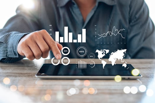 Business person analyzing financial statistics displayed on the tablet screen photo