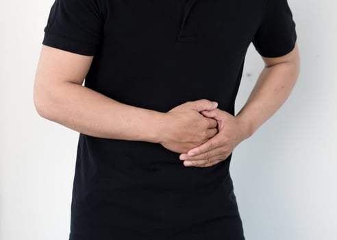 Man Suffering From Stomach Ache Healthcare and health insurance concept photo