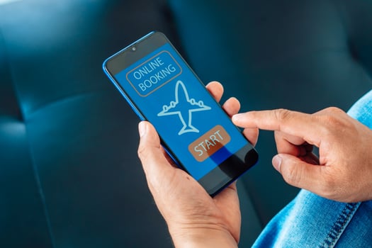 Flight booking application on mobile phone screen. Business and technology concept. photo