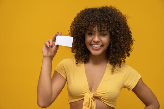 Young woman hand hold blank white card mockup with rounded corners. Plain call-card mock up template holding arm. Plastic credit namecard display front. Check offset card design. Business branding. photo