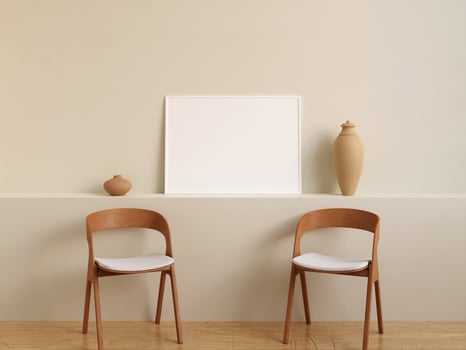Modern and minimalist horizontal white poster or photo frame mockup on the wall in the living room. 3d rendering.