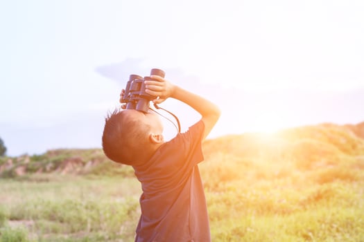 Happy kid playing outdoors. Travel and adventure concept photo