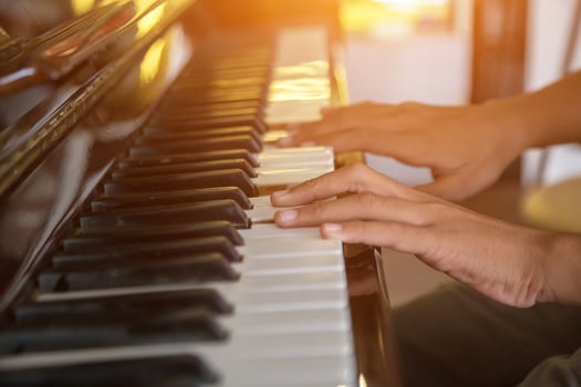Musician playing piano with vintage filter. photo