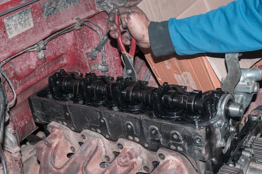 The mechanic is checking the engine. photo