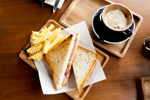 Coffee time with coffee, sandwiches, ham and cheese. photo