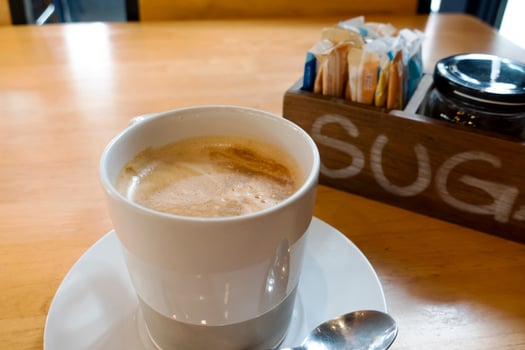 Hot coffee on wooden table photo