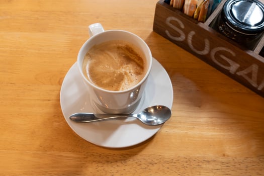 Hot coffee on wooden table photo