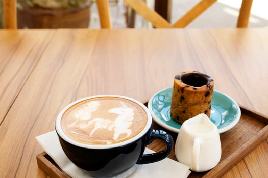 Hot latte with cookies on a wooden table photo