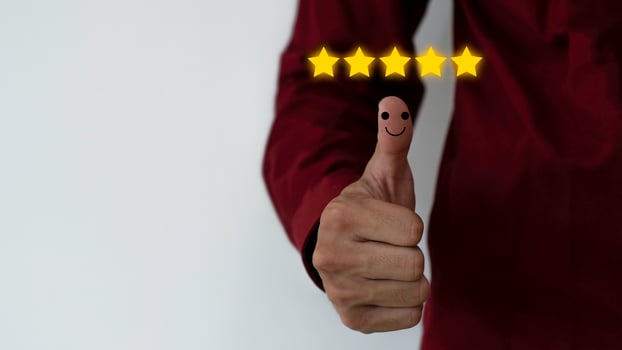 Close up on Customer Man Hand press on smartphone screen with gold five star comment icon and excellent press level for best rating in business idea service review. photo