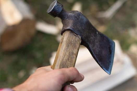 Close up piture of chopping firewood, country photo with wood and axe