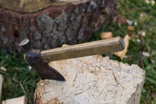 Close up piture of chopping firewood, country photo with wood and axe