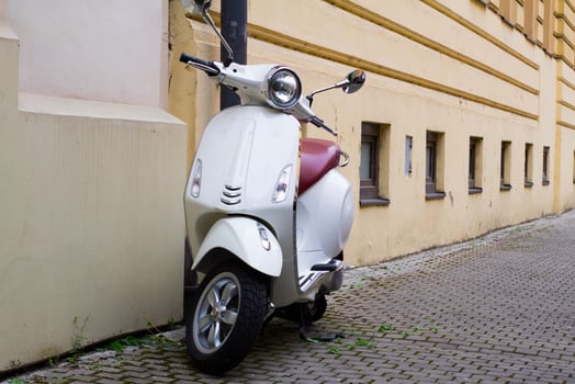 Vintage scooter on the old europe streets photo