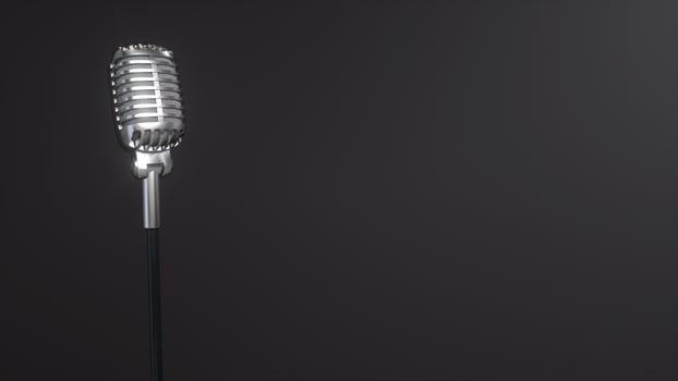 Silver retro microphone on black background photo