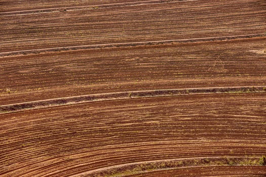 Aerial view of a plowed field ready for sowing. photo