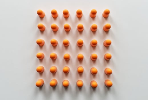 Orange foam ear plugs isolated on white background photo