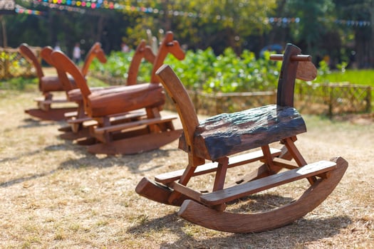 Rocking horse is handmade toys in park, Children like to play fun photo