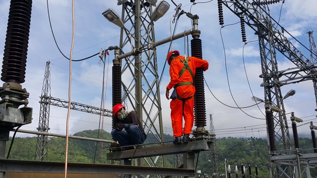 the electrician in red is doing periodic repairs photo