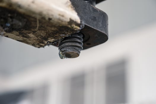 Dirty thread of the car lift machine with grease in workshop photo