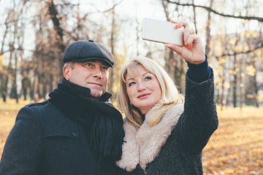 Happy blonde mature woman and handsome middle-aged brunette man photo