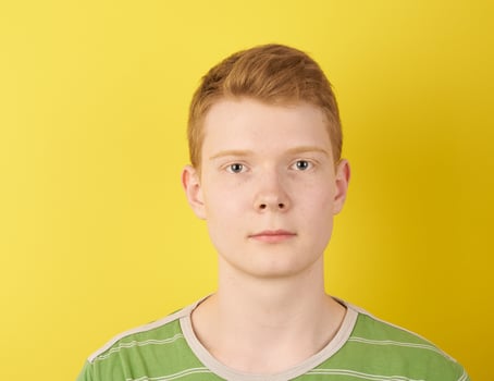 Irish redhead man on yellow background photo