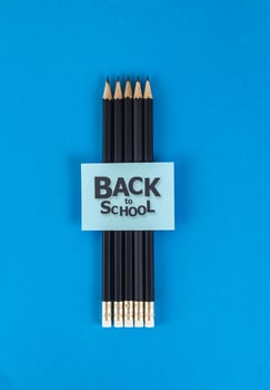 Black pencil on blue paper photo