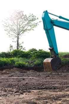 The backhoe loader vehicle with a tree. photo