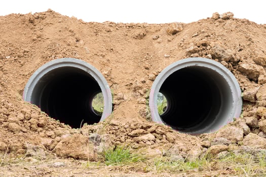 Concrete pipe under the ground. photo