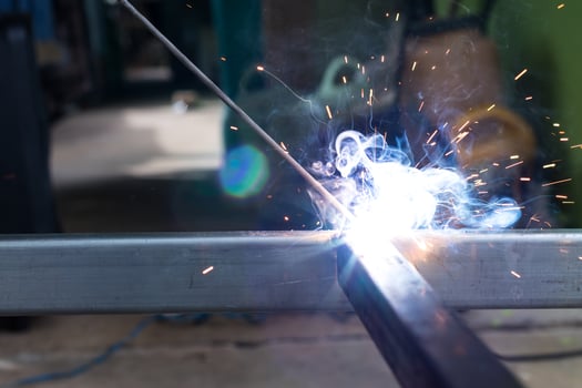 Sparks and smoke welding iron. photo