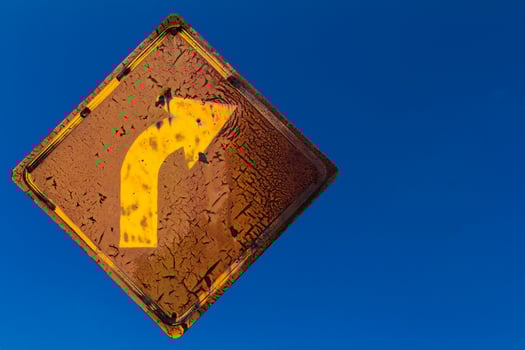 Old right turn sign in the sky. photo