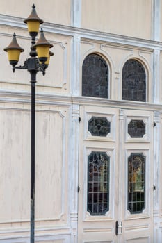 Antique concrete windows with lamp posts. photo