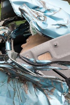 Close-up, light blue car was demolished. photo