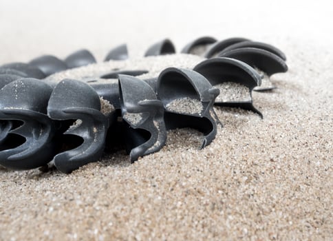 Plastic Pelton water turbine on sand with out water photo