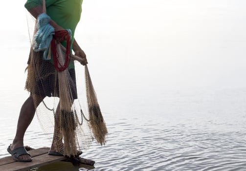 Close up of a man preparing to sow fishing. photo