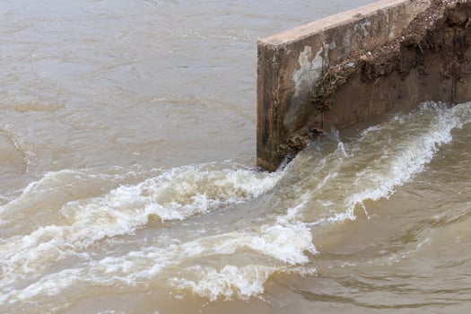 Water flows through concrete bridges. photo