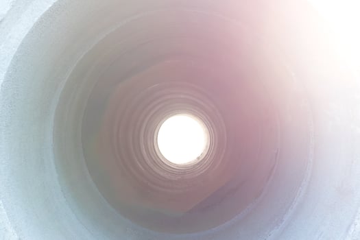 Light through the concrete pipe. photo