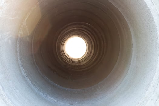 Light through the concrete pipe. photo