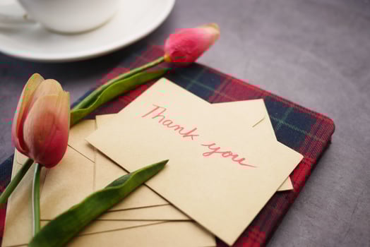 thank you message, envelope tulip flower on table photo