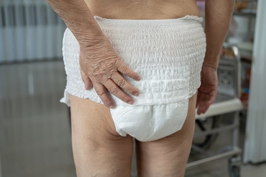 Asian senior or elderly old lady woman patient wearing incontinence diaper in nursing hospital ward, healthy strong medical concept. photo
