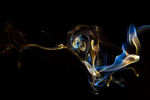 Colorful smoke on black background photo