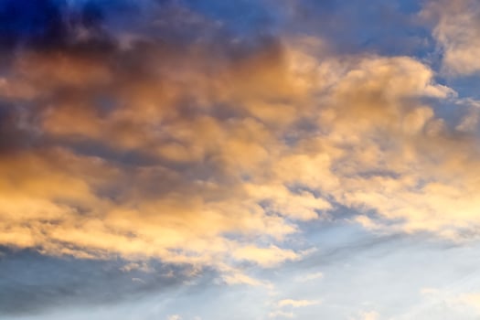 Beautiful panorama of orange and yellow clouds at sunrise photo