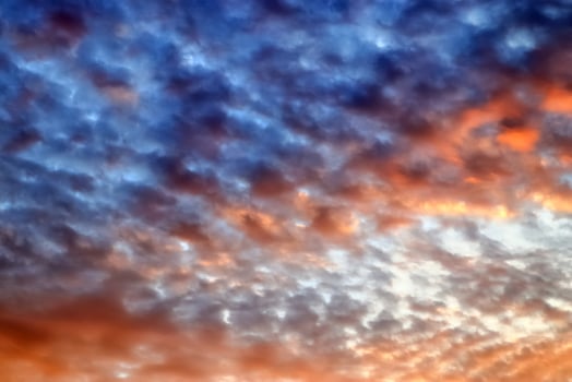 Beautiful panorama of orange and yellow clouds at sunrise photo