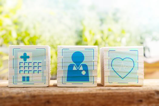 Access to the hospital, see a doctor for the right treatment.,wooden box with hospital, doctor and treatment icons photo
