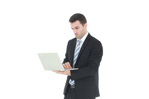 Successful and handsome  businessman in a suit smiling with hand holding notebook. He serious in working on a laptop isolated on white background. Copy space photo