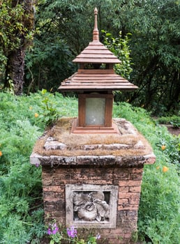 Garden lamp with the floral sculpture. photo