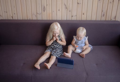 kids watching cartoons on tablet photo