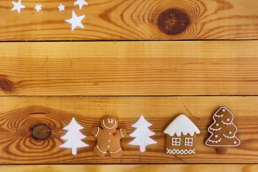 Christmas gingerbread cookies on wooden background photo