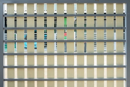 Artificial wooden fence on the metal frame photo